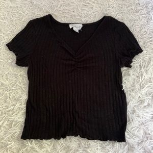 black cropped shirt with a v-neck